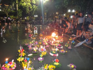 Loy Krathongs being set afloat on the lake