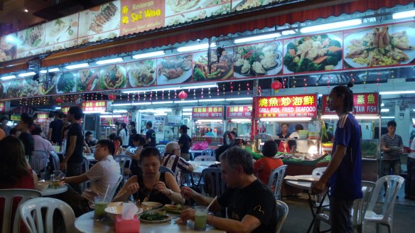 Street hawker food stall, with all the dishes shown at the top in giant pictures for easy ordering.