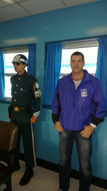 Inside the building in the JSA where the Korean War ceasefire was signed.  He looks like a mannequin, but that's an actual South Korean military guy next to me. 