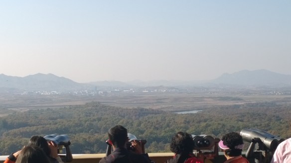 Looking into North Korea.  Where the trees stop is where the border is. White buildings in middle of pic is the "propaganda village".