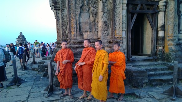 Monks at Phnom Bakheng Temple... aka, the "sunset temple" where crowds of visitors climb a long pathway up a hill to the temple, then climb several sets of near-vertical stairs to get to the top of the temple to watch the amazing sunsets.