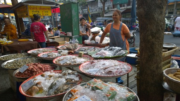 Vendor selling her fish, squid and other fresh food 
