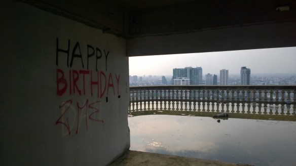 A little graffiti, a balcony filled with a rainwater pond, and beautiful view to the west.