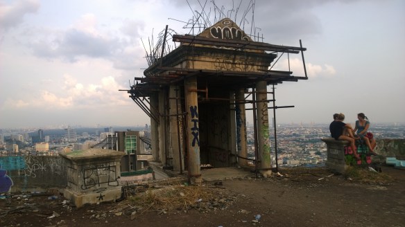 The pillars and entrance to the stairwell leading back down.  The columns are held together and in place by a lot of rickety metal braces...